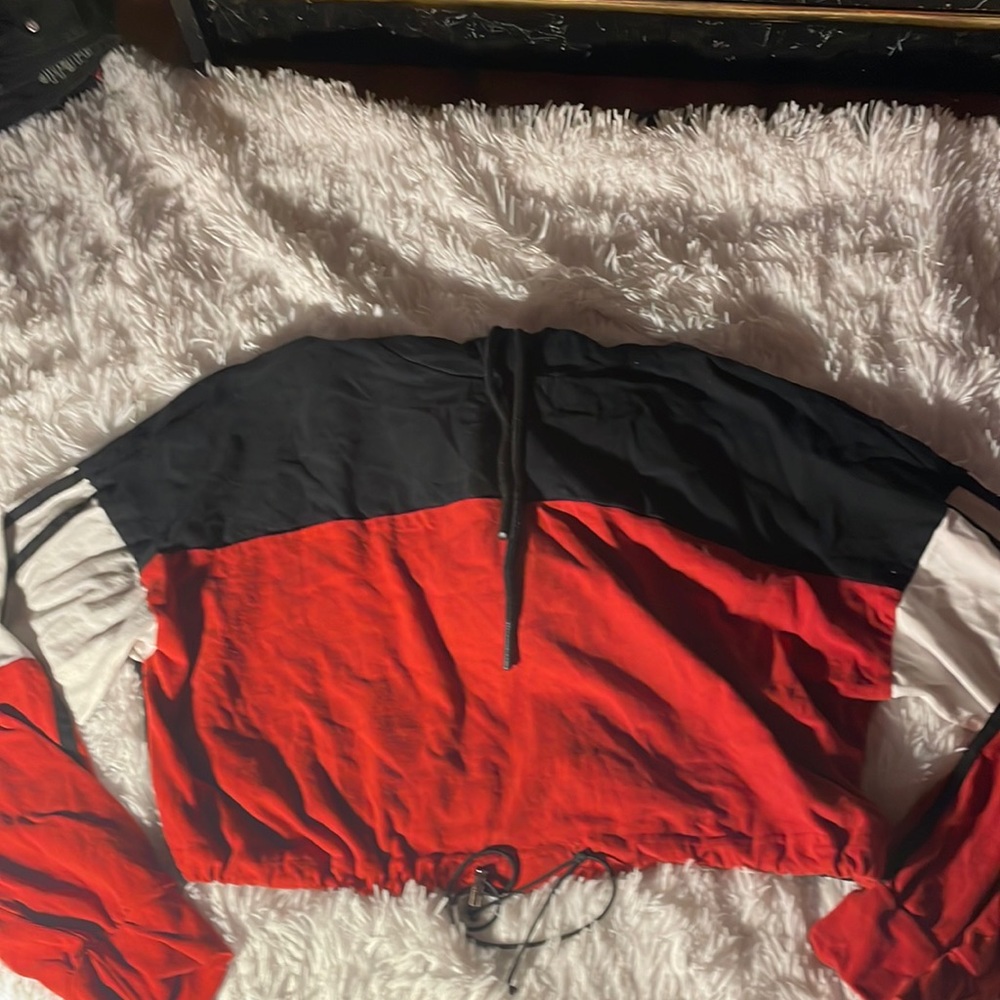 black, white, and orange cropped adjustable hoodie